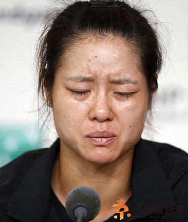 赛后发布会李娜表情痛苦