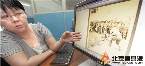 6月12日，中国第二<a href='http://www.bjxxg.cn/news/lishi/' target='_blank'><u>历史</u></a>档案馆工作人员展示申报档案中由日军拍摄的屠杀照片。 新华社发